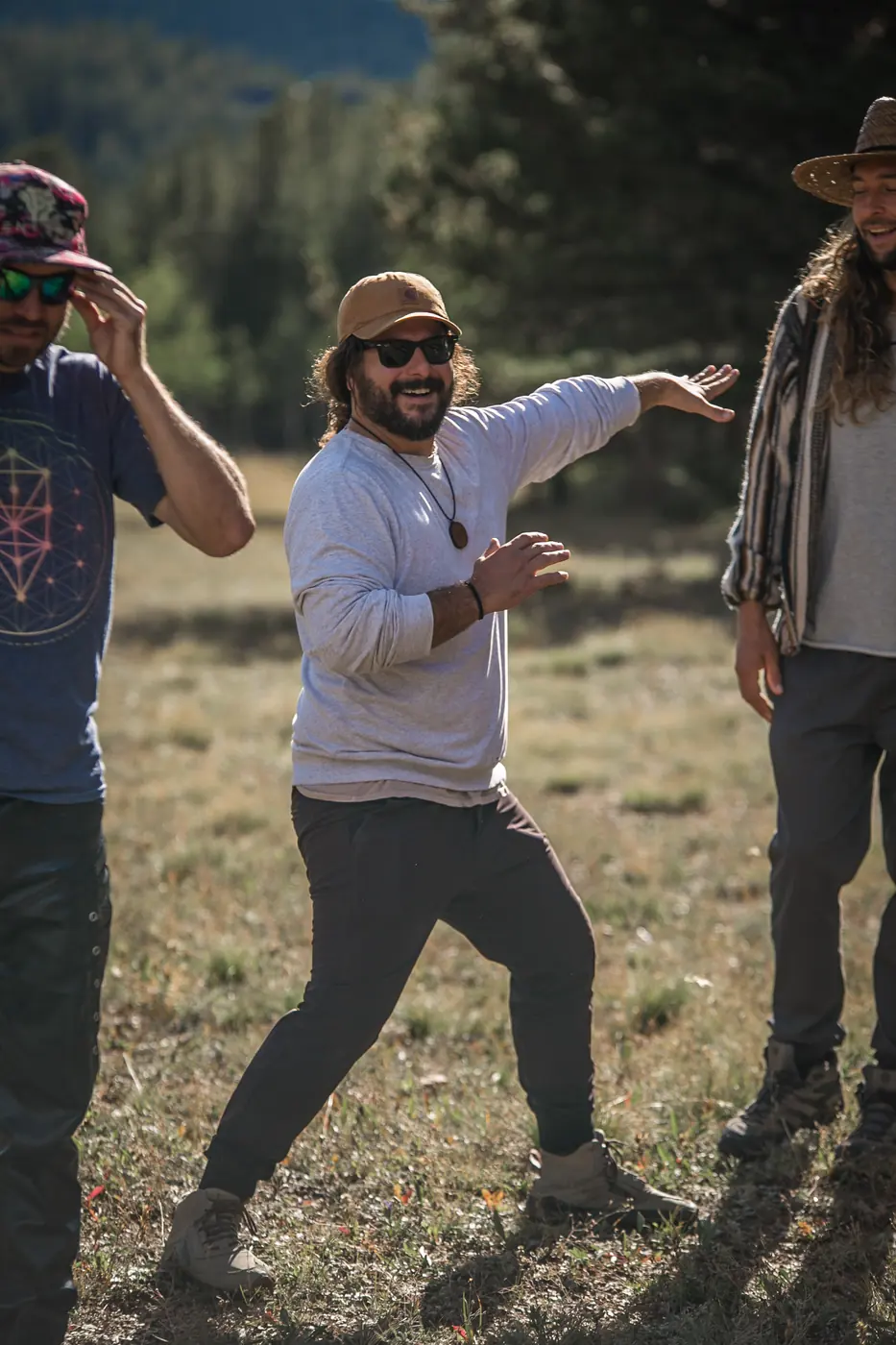 Mike laughing with friends at a retreat in the Colorado mountains